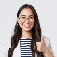Business, finance and employment, female successful entrepreneurs concept. Confident smiling businesswoman provide best service, assure its good deal, thumbs-up in approval.